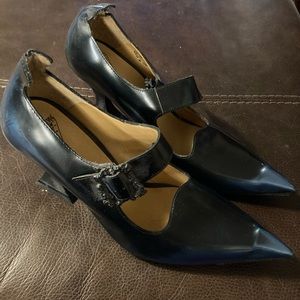 Size 8 1/2  navy blue . Never worn. Buckles have amazing skull details